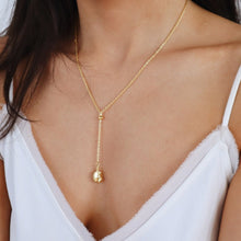Load image into Gallery viewer, Woman wearing the gold coffee bean necklace